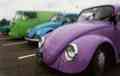 The gang's cars lined up at a service station