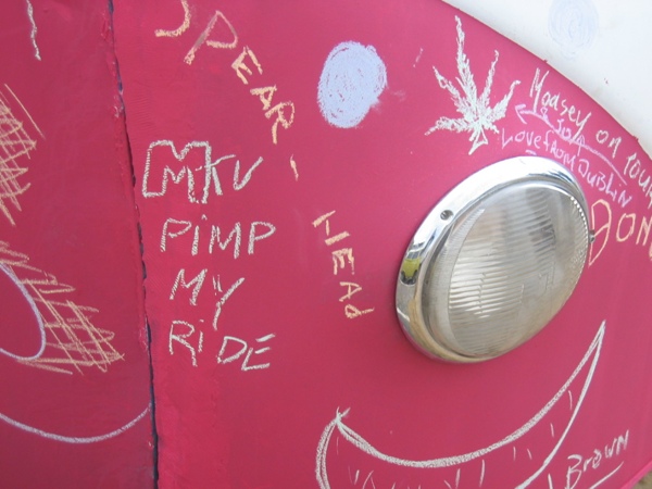 Writing on the side of George's bus