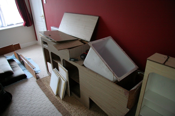 Starting to dismantle the main cabinet, and restoring the icebox