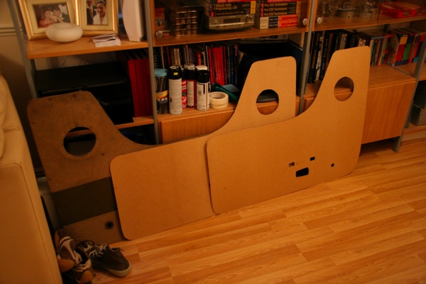 Two new door cards cut from hardboard, ready to be recovered